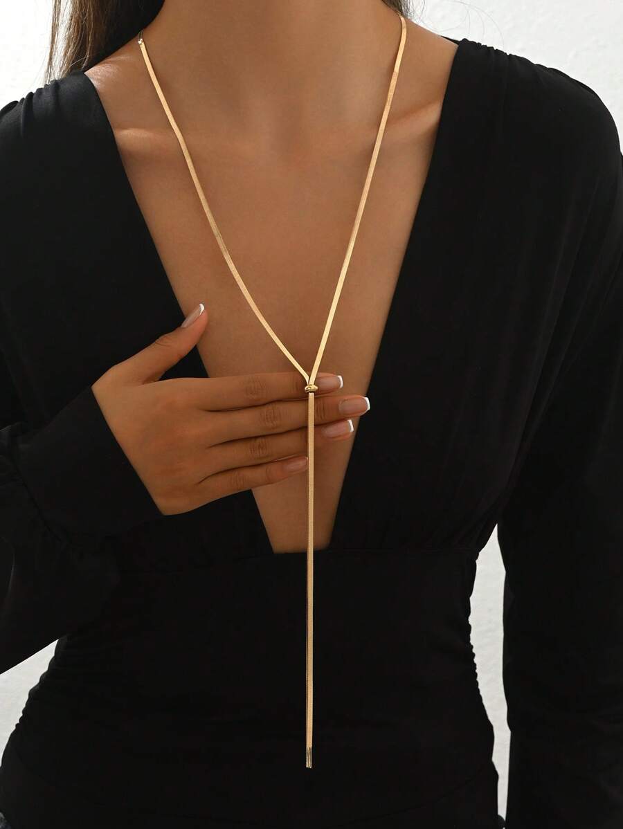 Colore:Collana in oro a forma di Y con osso di serpente