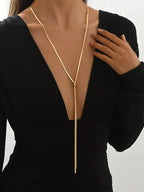 Colore:Collana in oro a forma di Y con osso di serpente