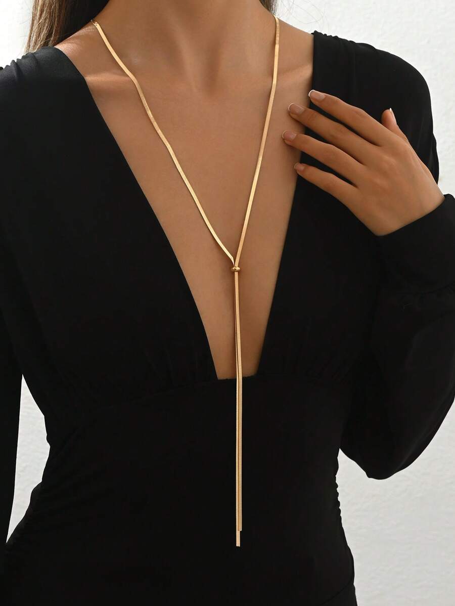 Colore:Collana in oro a forma di Y con osso di serpente