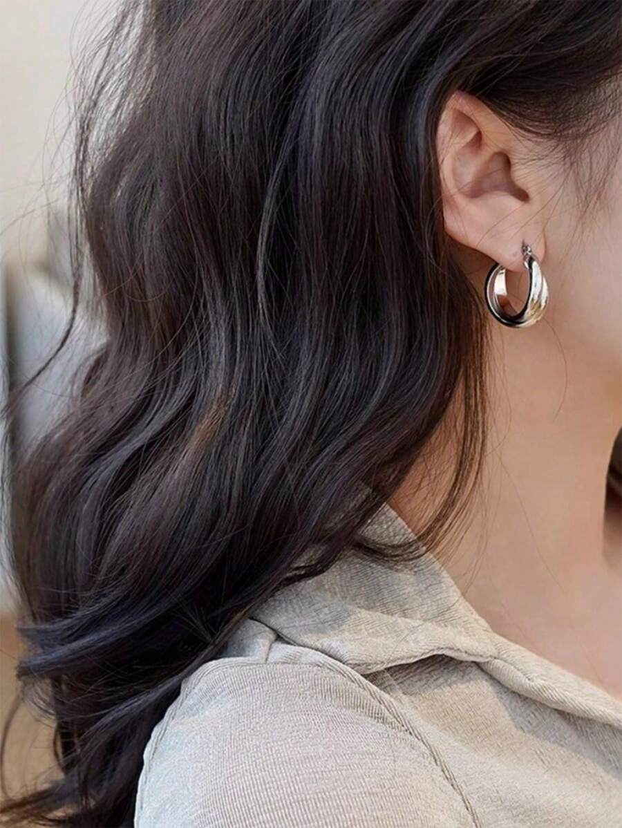 Colore:Orecchini Mobius in argento