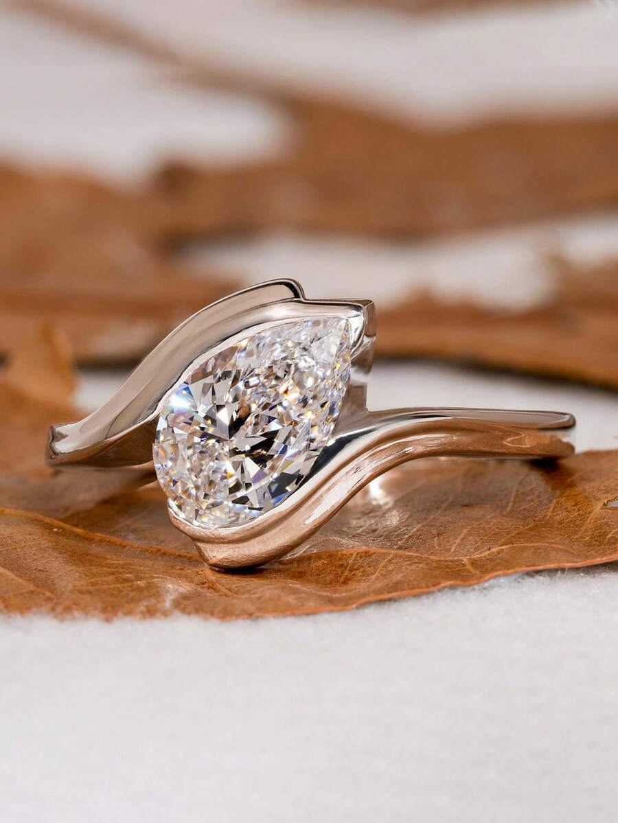 Tipo di stile:Anello a forma di goccia d'acqua con braccio attorcigliato
