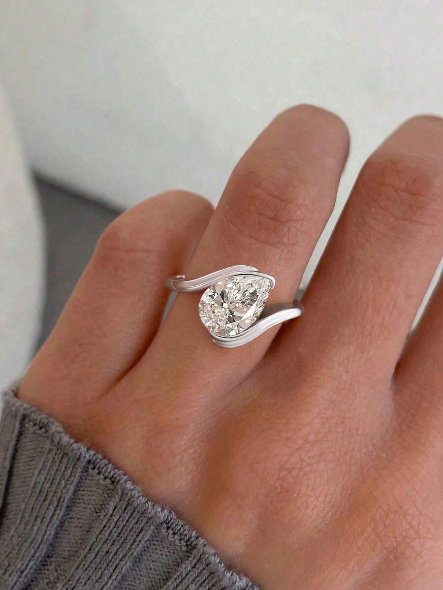 Tipo di stile:Anello a forma di goccia d'acqua con braccio attorcigliato