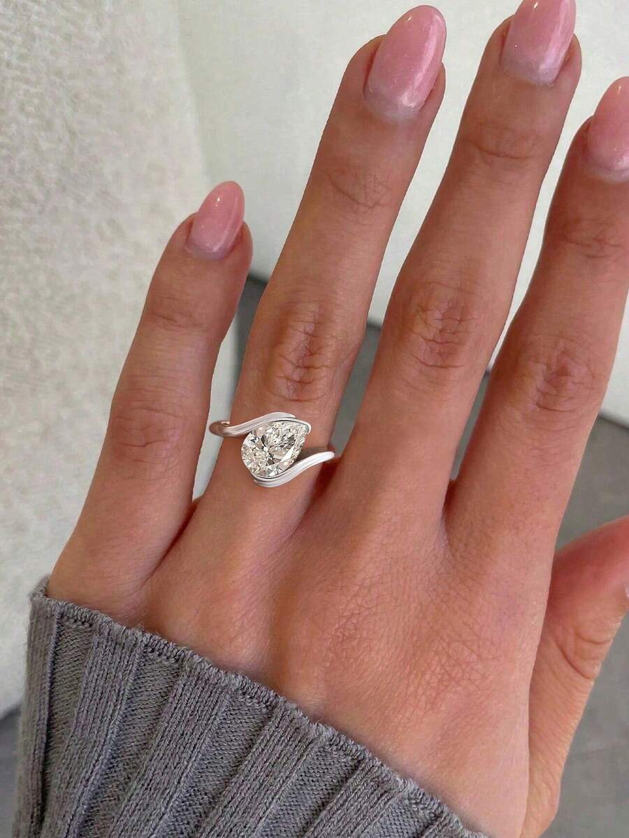 Tipo di stile:Anello a forma di goccia d'acqua con braccio attorcigliato
