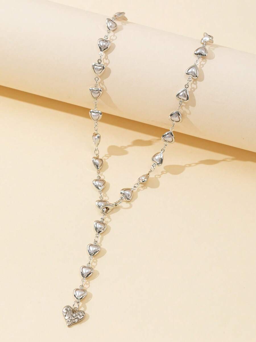 Colore:Ciondolo a forma di cuore in argento con perla