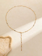 Colore:Collana a forma di croce a Y